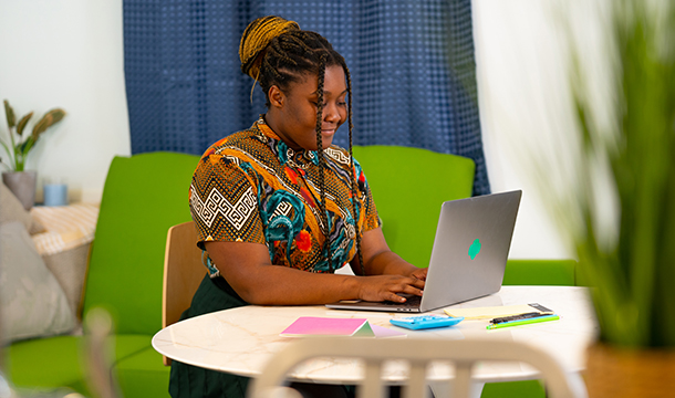 woman sitting at laptop computer