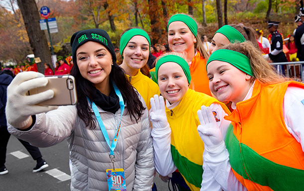 six girls taking a selfie at a winter parade